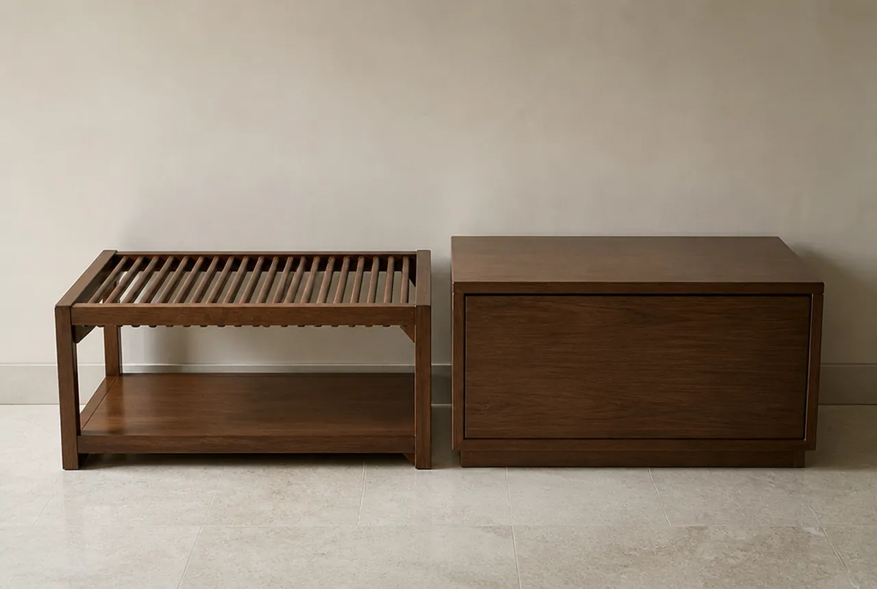Two luggage pieces side by side on pale seamless, one an open slatted bench and one an enclosed lidded cabinet